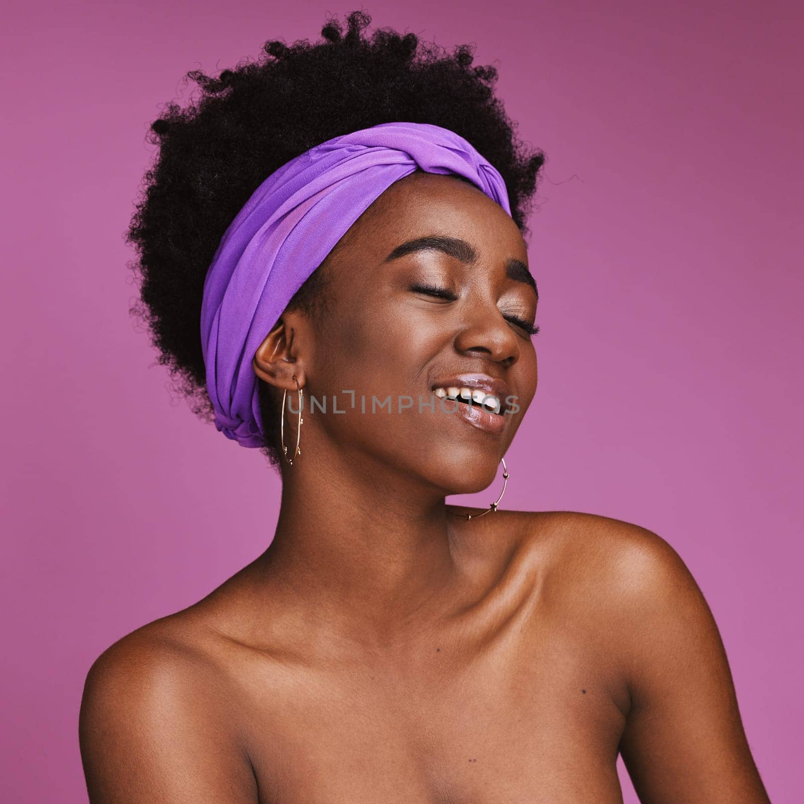 Face, beauty and skincare with a model black woman on a pink background in studio for natural care. Aesthetic, hair and headband with an attractive young female posing to promote cosmetic treatment by YuriArcurs