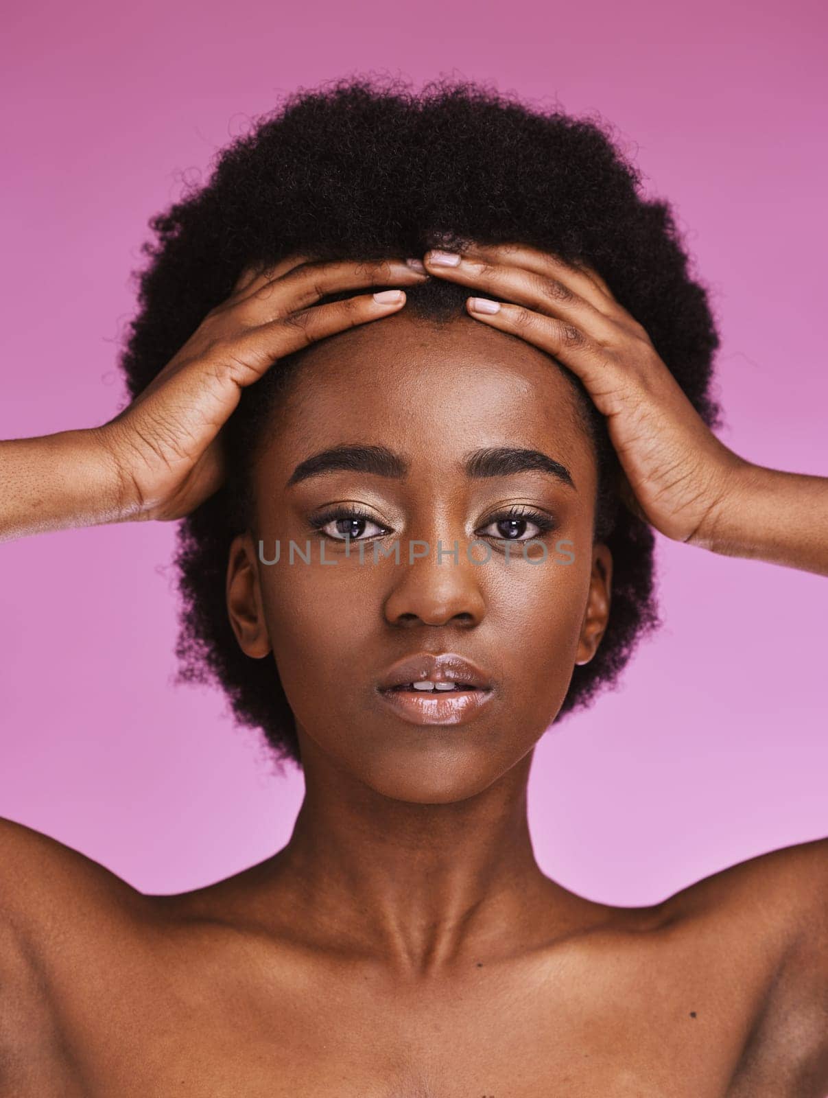 Black woman, portrait or touching afro hairstyle in relax beauty skincare, growth texture maintenance or salon wellness. Hands, hair or natural face makeup on studio model or isolated pink background.