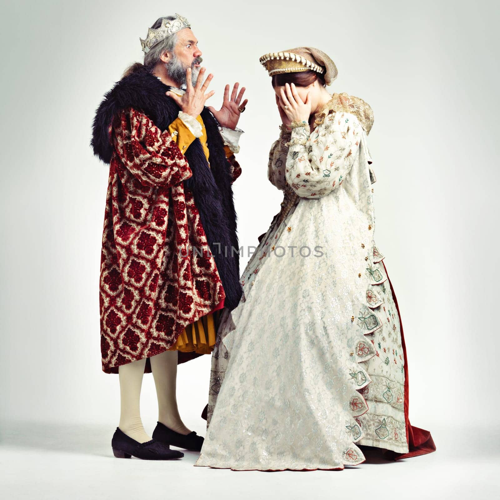 King man, queen and argue in studio with anger, frustrated and crying in relationship, theater and drama. Medieval royal couple, fight and conflict conversation in renaissance, stress and woman cry.