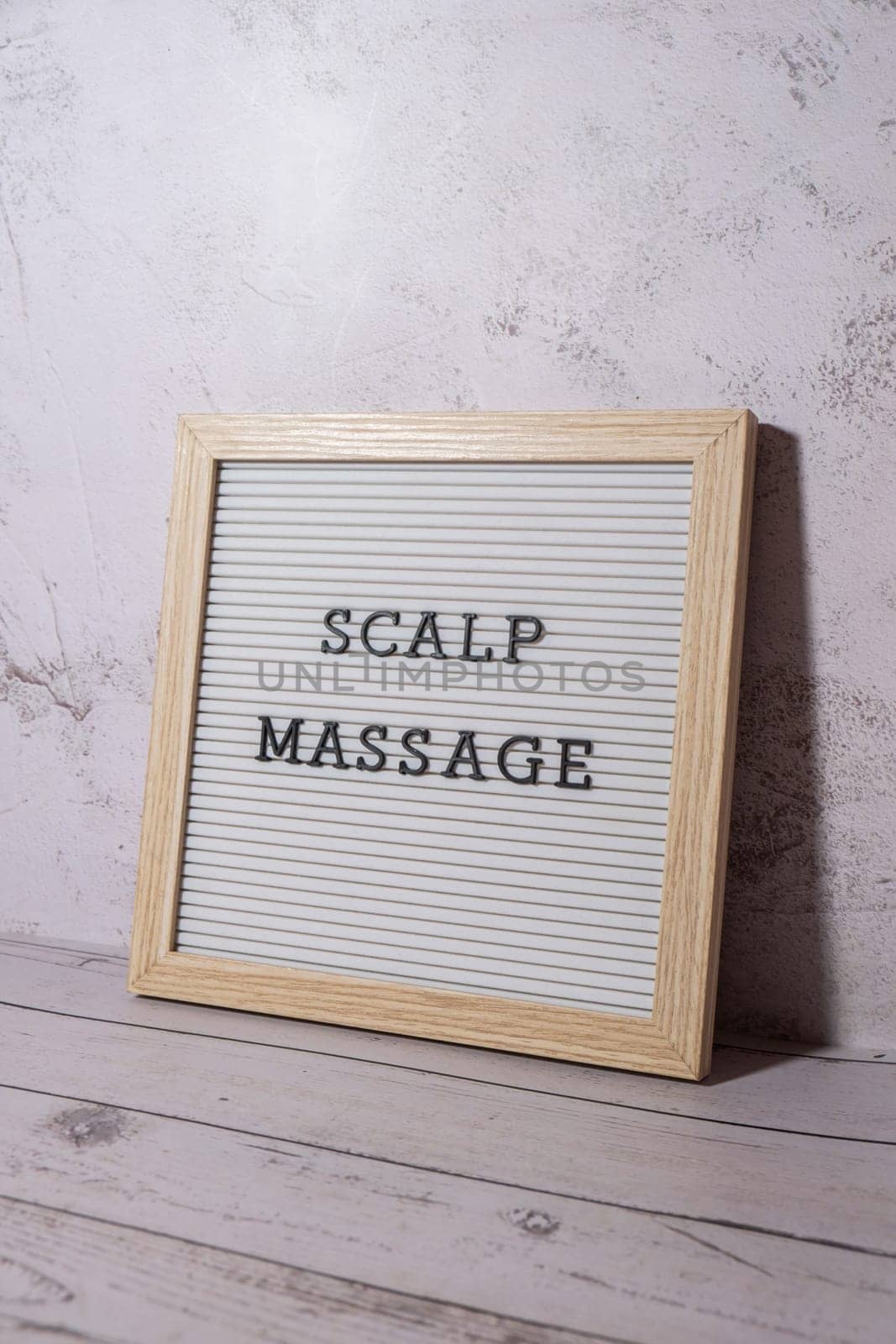 Letter board SCALP MASSAGE text. Hair growing routine. Wellness wellbeing concept Anti stress Medicine and cosmetology. SPA treatment