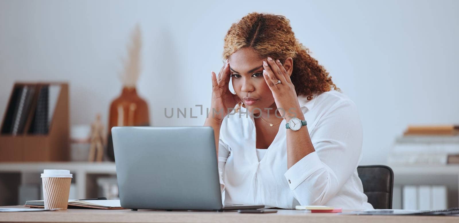 Stress, angry and woman with a startup fail, headache and sad in a company office desk working on a laptop. Frustrated, burnout and young entrepreneur thinking of a risk or problem, tired and mistake.