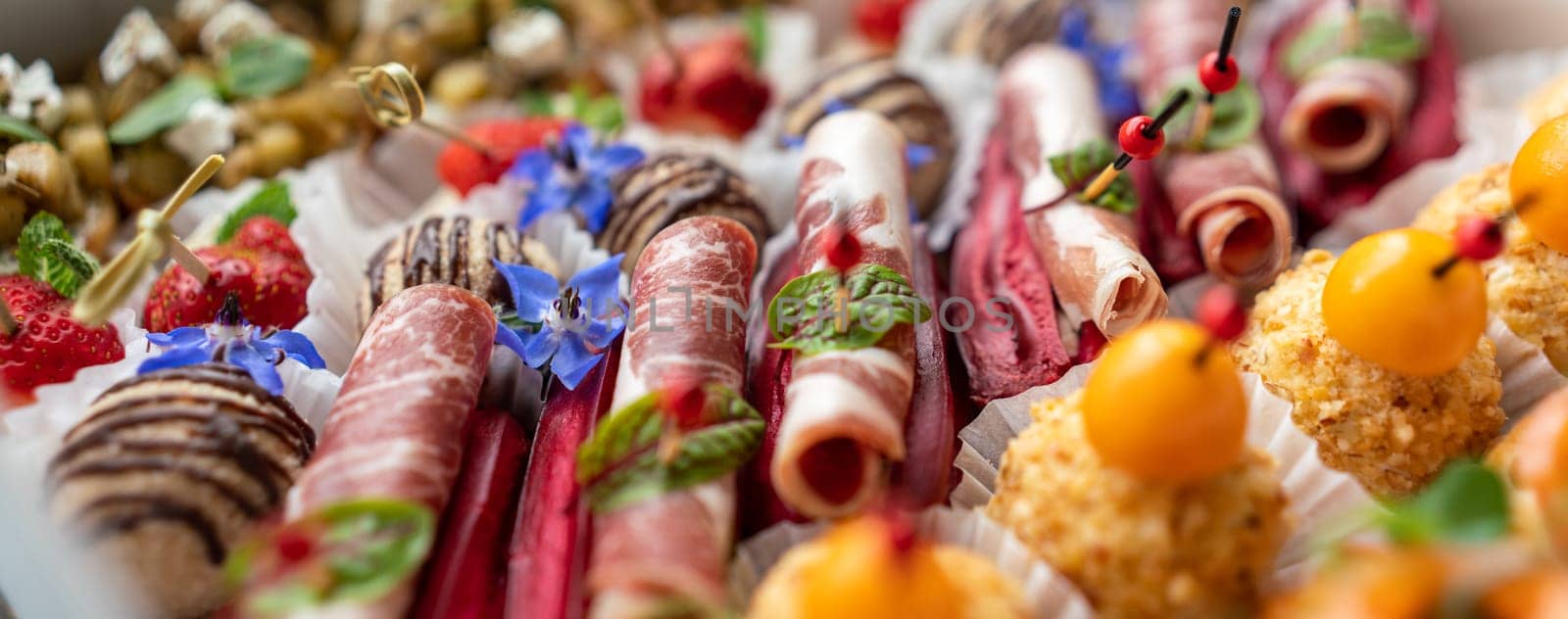 Catering service. Set of beautiful canapes. Buffet table. Shallow depth of view. by Matiunina