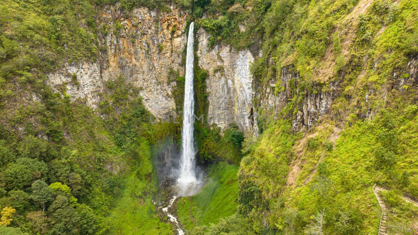 Beautiful waterfall in the tropics. Sipiso Piso falls. Sumatra, Indonesia.