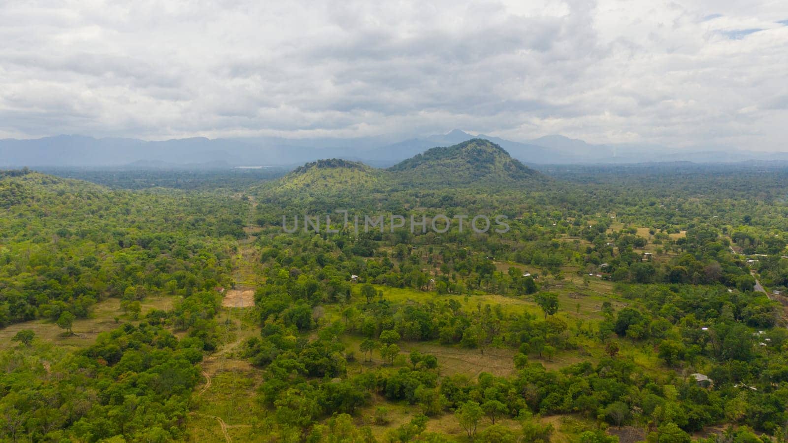 Aerial view of Mountain valley with farmland and tropical forest. Sri Lanka.