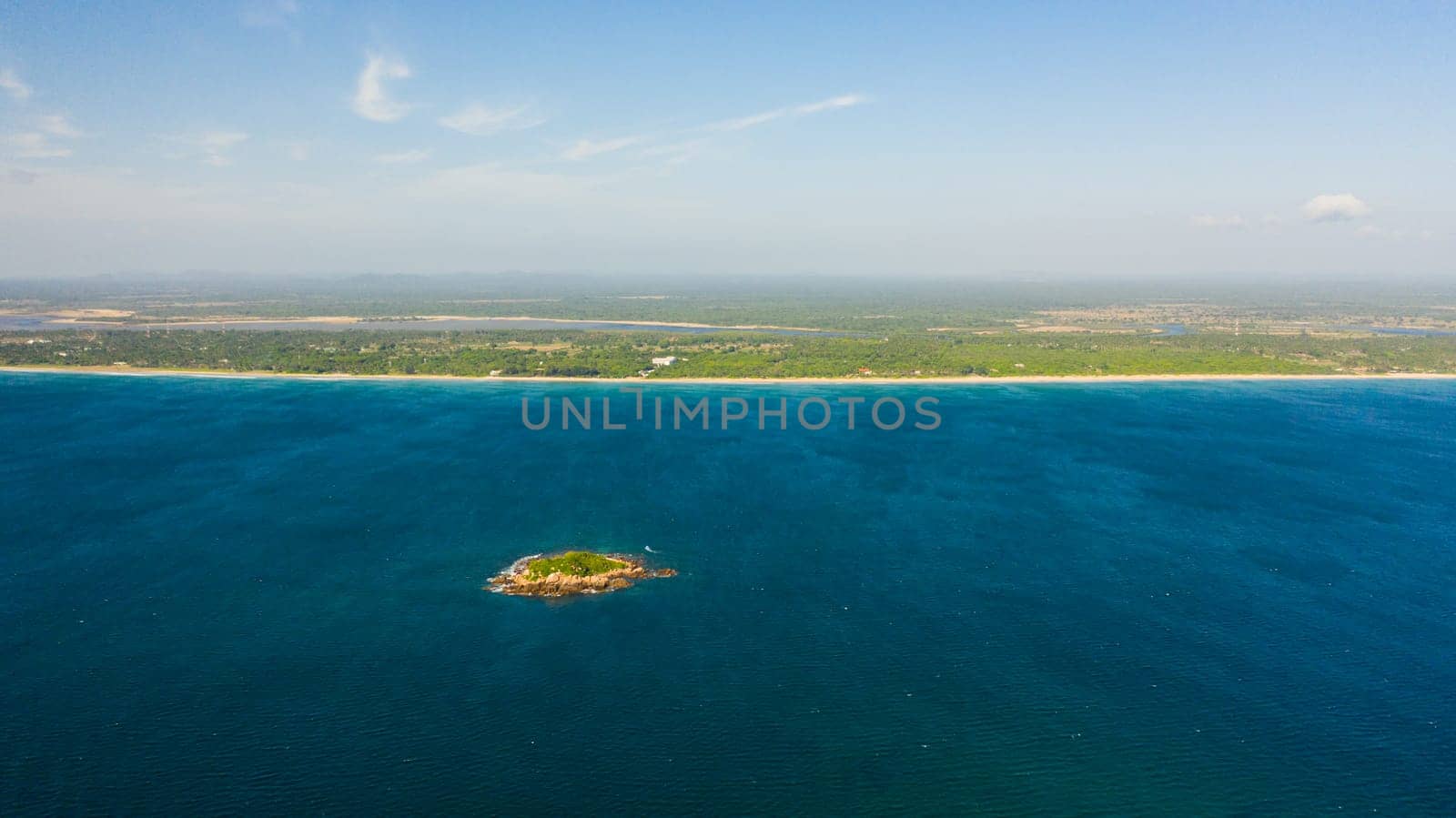 Aerial view of sea coast of the island of Sri Lanka with a sandy beach. Nilaveli Beach, Trincomalee.