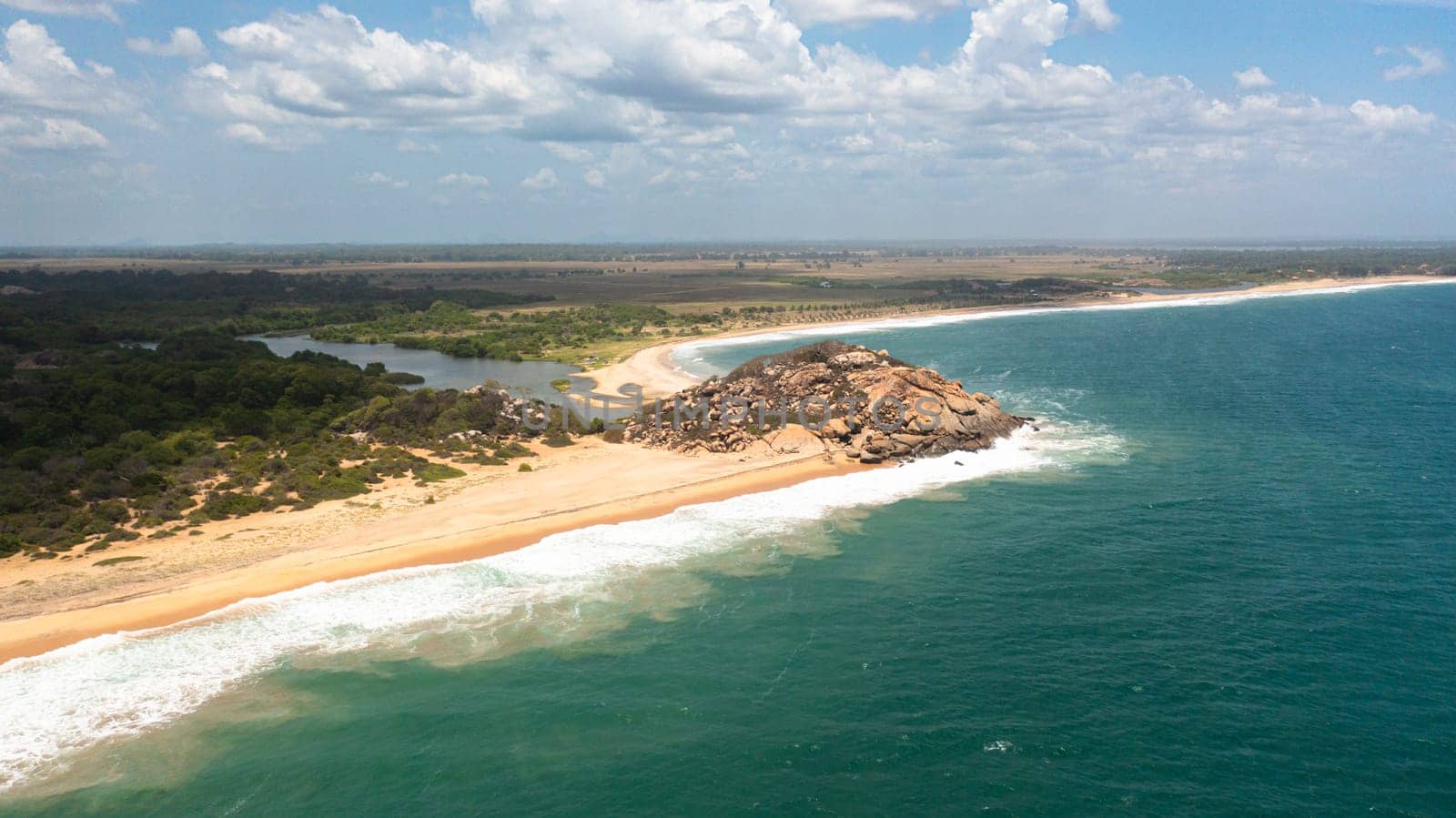 Aerial view of Tropical sandy beach and blue ocean. Peanut Farm Beach. Sri Lanka.
