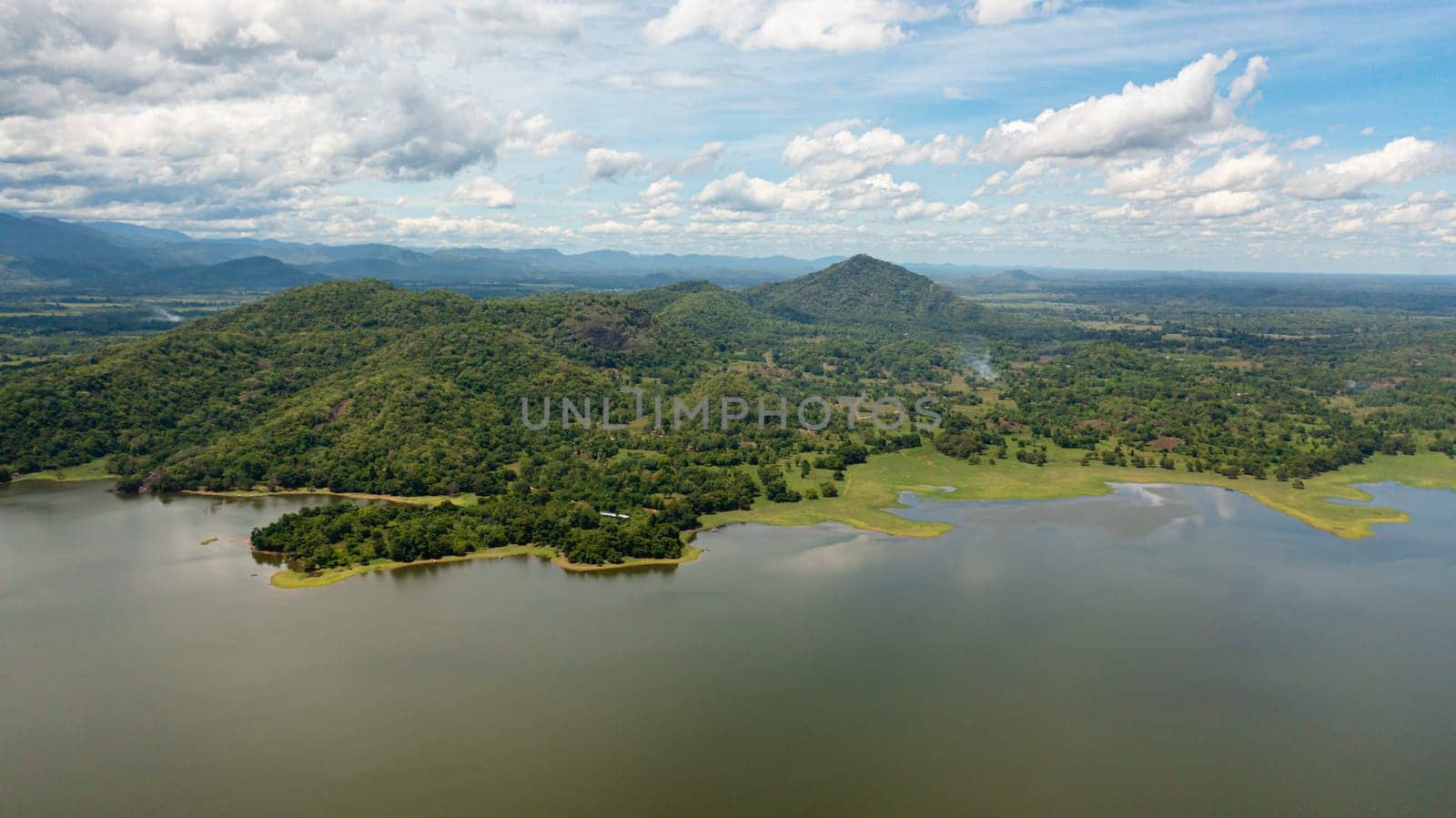 Top view of lake and valley with tropical forest. Sorabora lake, Sri Lanka.