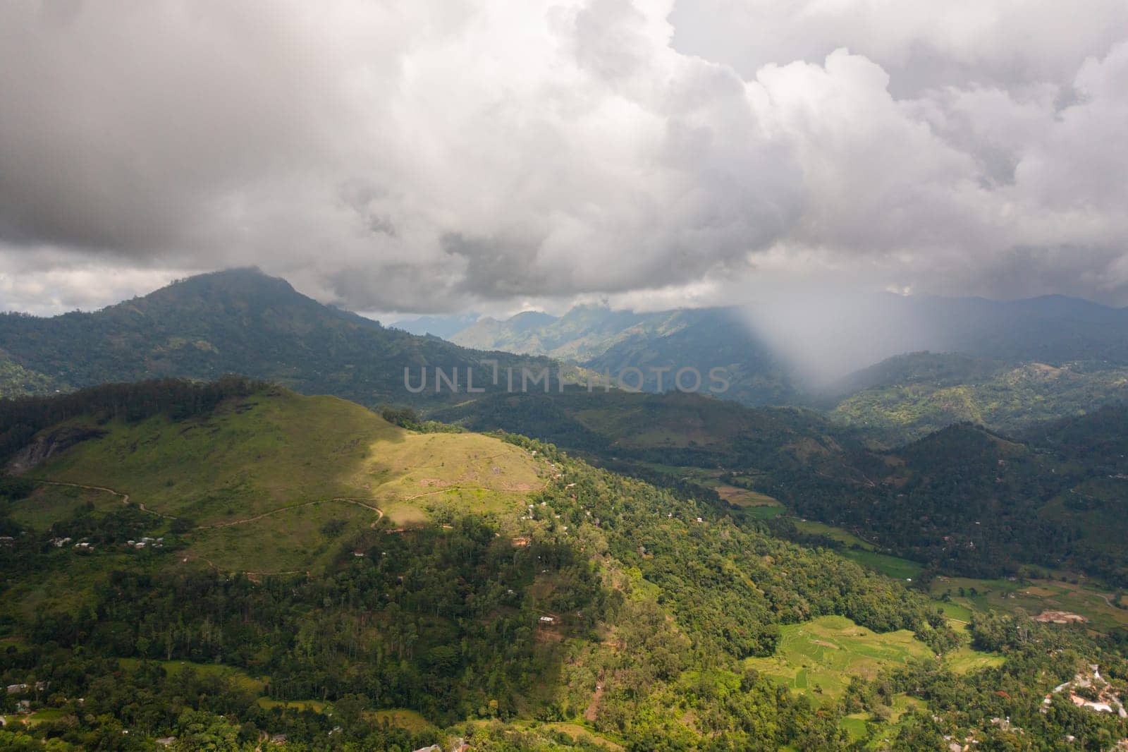 Mountain slopes with rainforest and agricultural land of farmers. Sri Lanka.