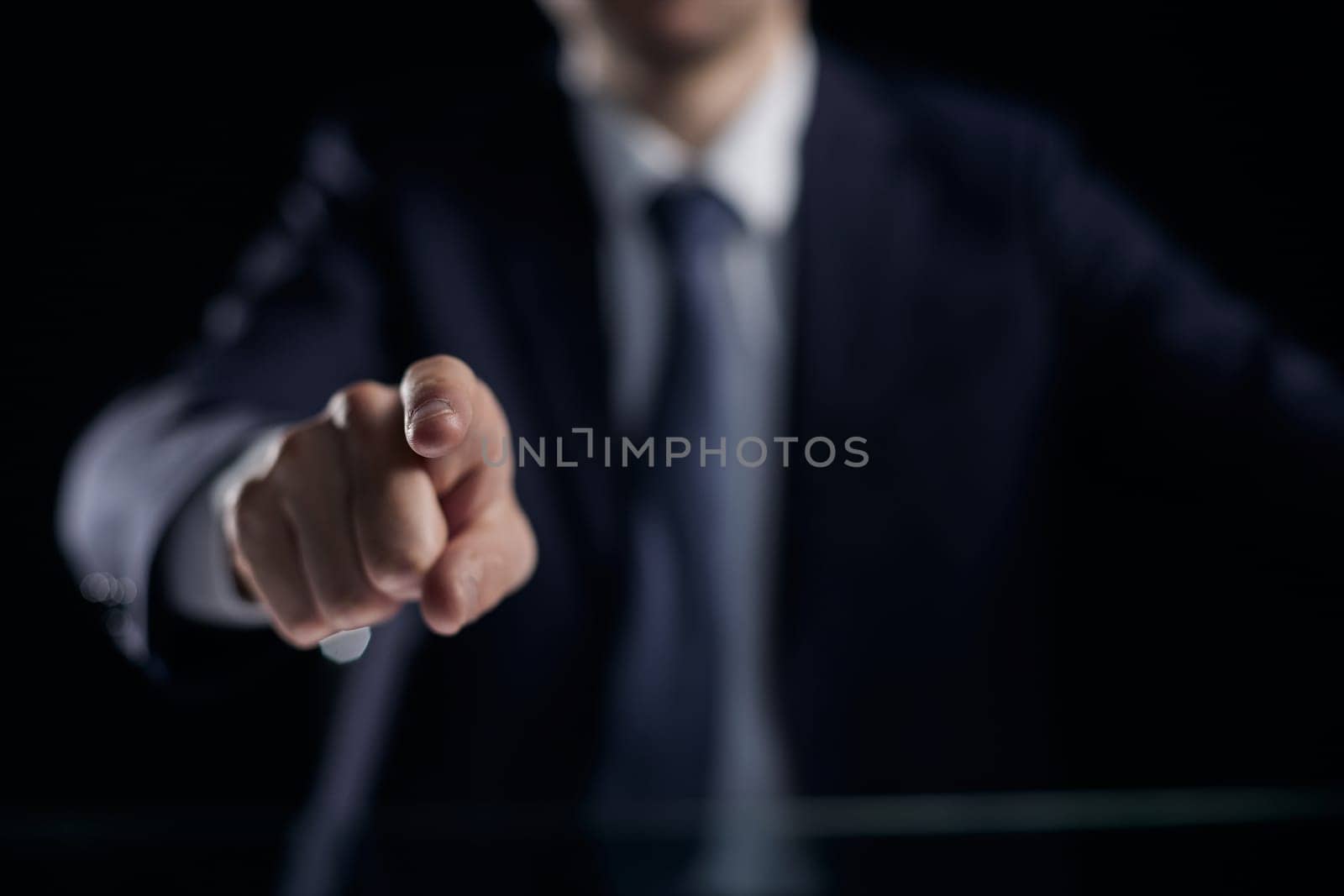 the man points his finger at you. close-up