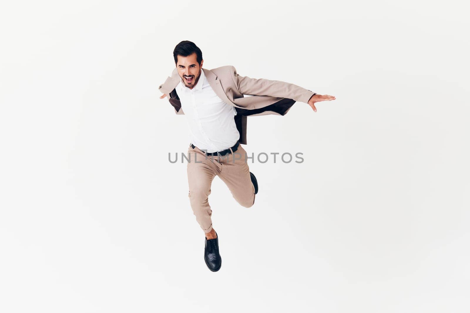 beard man job suit eyeglass victory fashion jacket flying male happy winner young running smiling businessman isolated occupation beige copyspace business arm