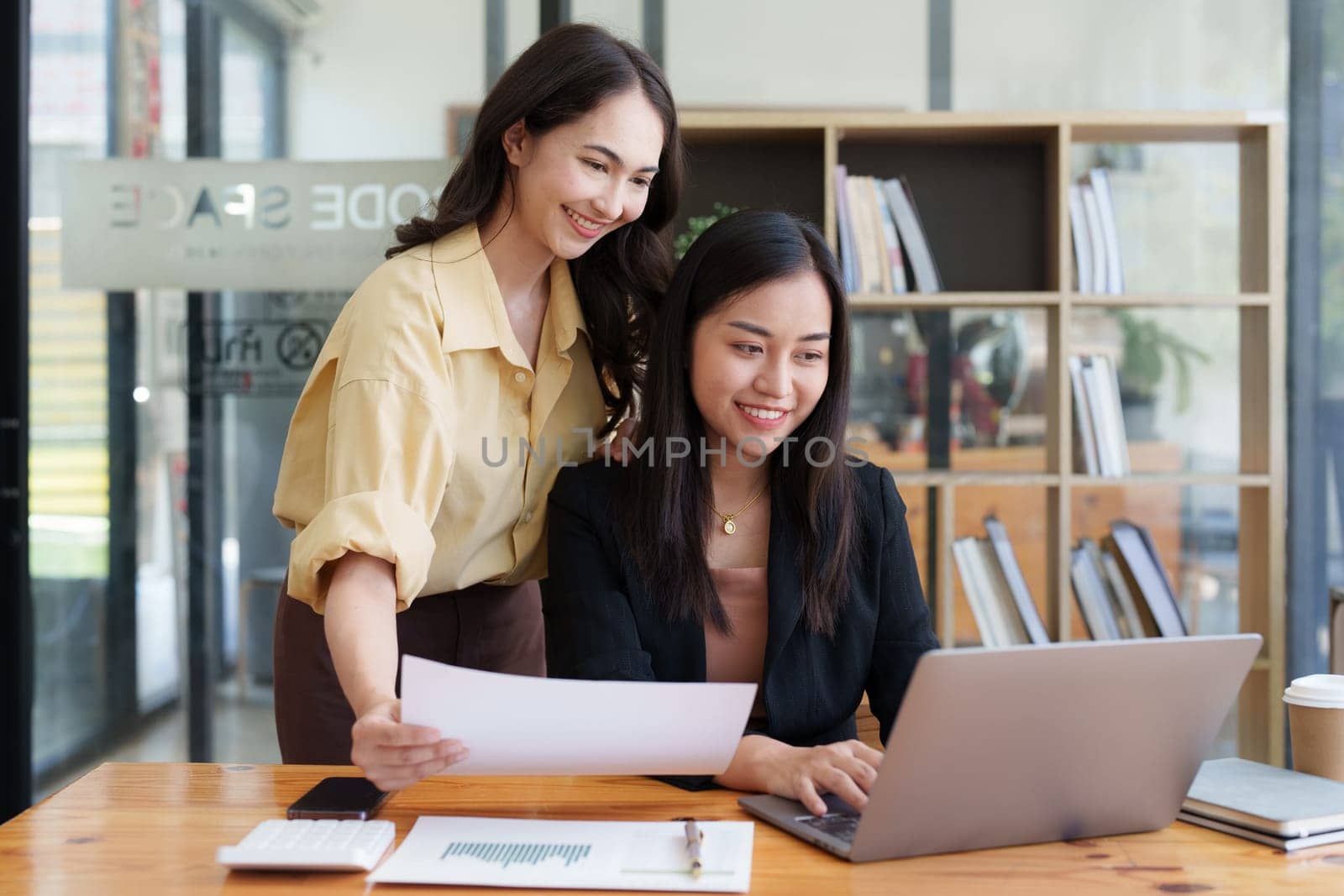 Diverse colleagues gather brainstorm discuss financial statistics at office meeting. finance, teamwork, Big data Graphs Charts concept by itchaznong