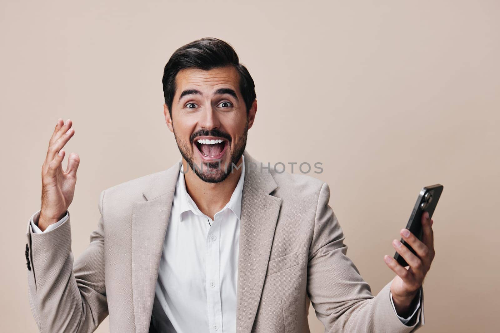 man business lifestyle message hold technology suit trading space guy confident online background happy studio portrait person copy smartphone smile phone call