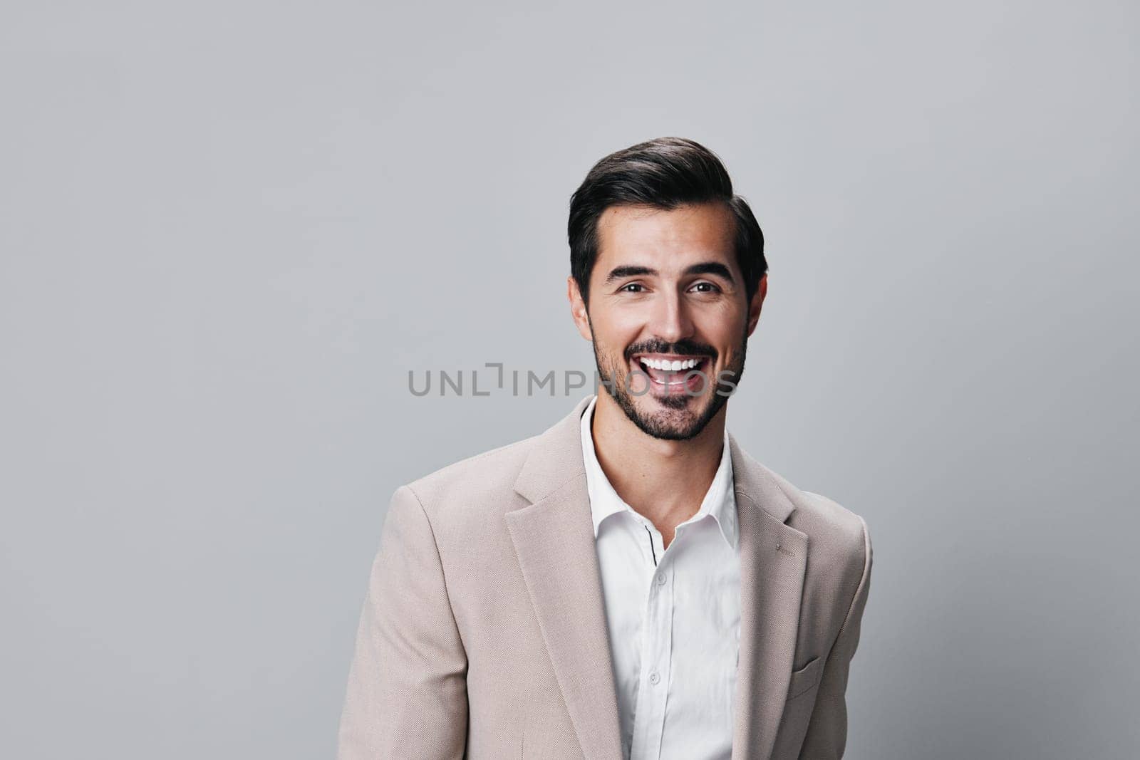 copyspace man beige businessman job smiling handsome happy business suit portrait by SHOTPRIME