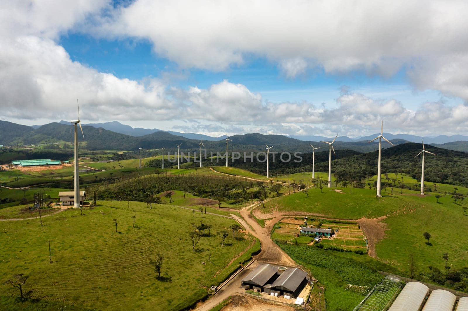 Wind turbines farm in the mountains. Windmills for renewable electric energy production. Ambewela Wind Power, Sri Lanka.