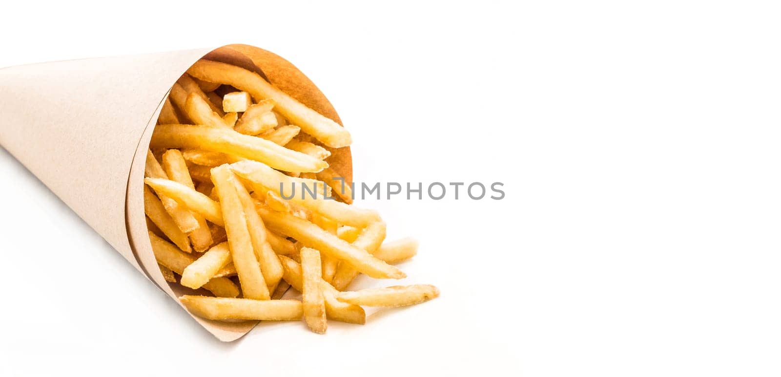 Fresh french fries chips wrapped in brown craft paper on a white background