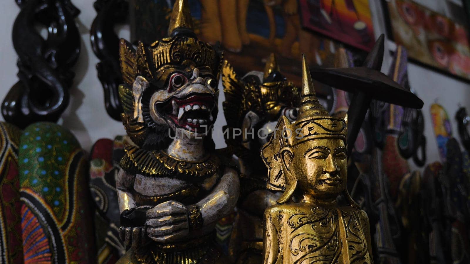 Hindu and Buddhist wooden carving. souvenir shop selling souvenirs and handicrafts of Bali at famous Ubud Market, Indonesia