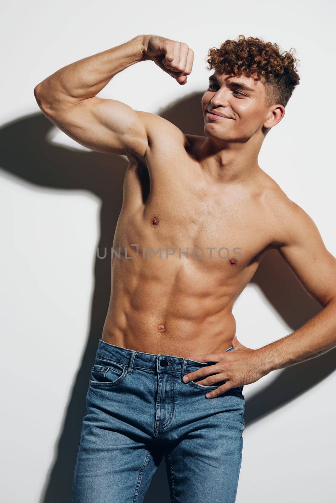 man fitness chest muscular jeans sexy sport gray background attractive naked guy care by SHOTPRIME