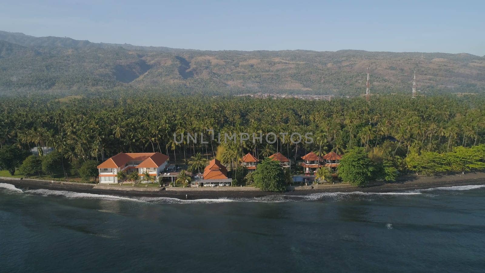 aerial seascape luxury hotel on beach background mountainss in tropical resort. Bali,Indonesia, travel concept.