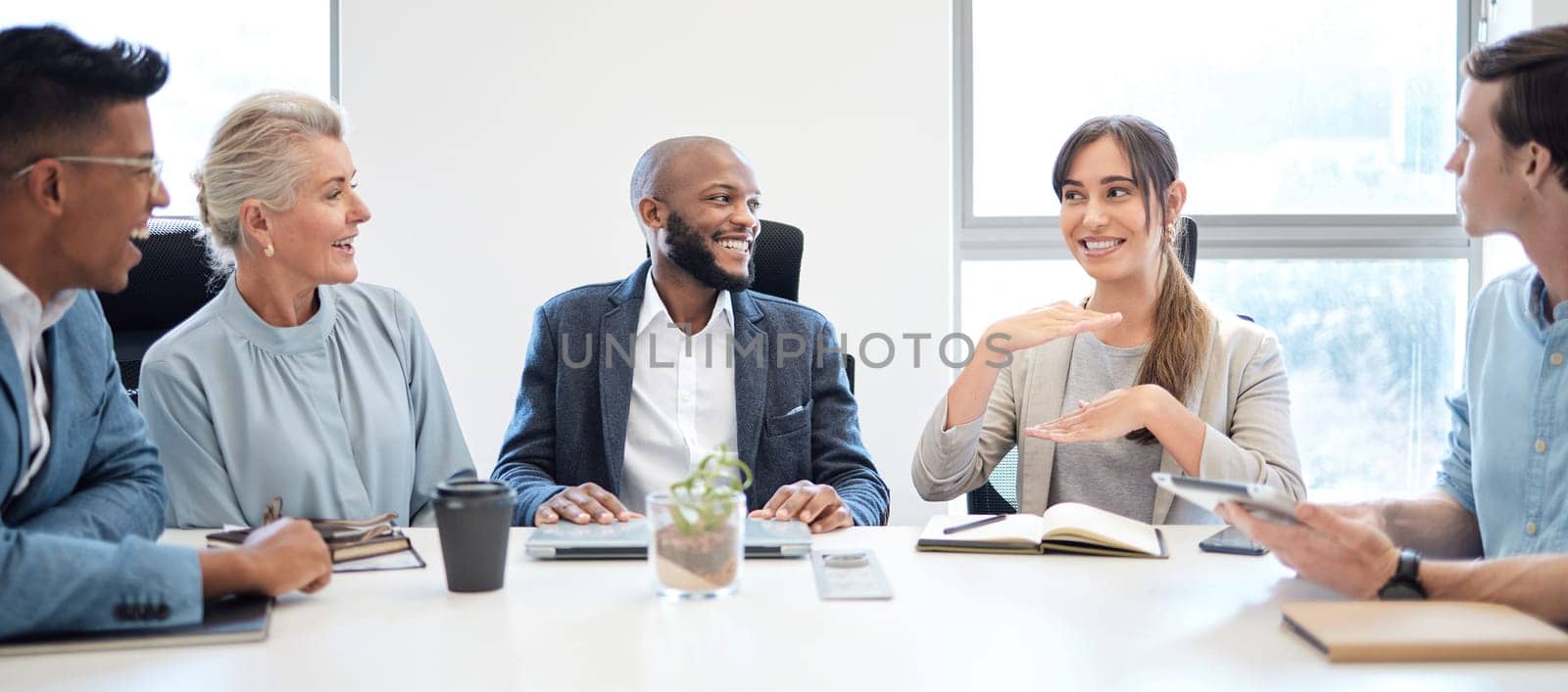 Meeting, planning and collaboration with a business woman talking to her team in the boardroom at work. Teamwork, strategy and brainstorming with a female employee in the office to explain her vision.