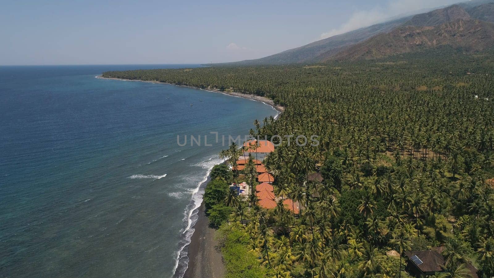 aerial seascape luxury hotel on beach background mountainss in tropical resort. Bali,Indonesia, travel concept.