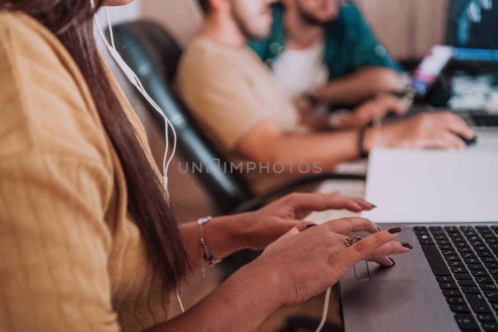 Close up image of woman hands typing on laptop computer keyboard and surfing the internet on office table, online, working, business and technology, internet network communication concept. High quality photo