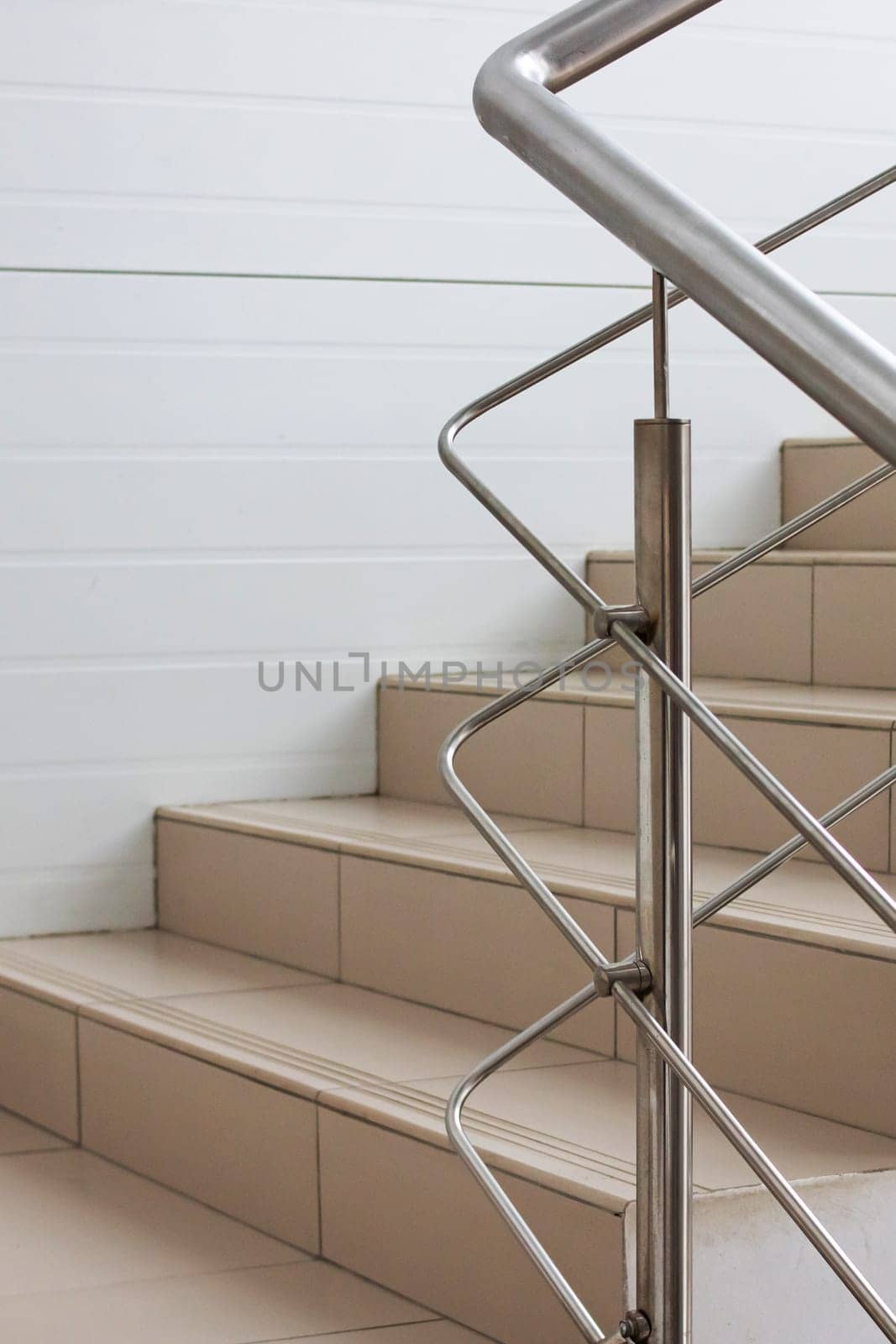 Brown staircase with metal railings close up indoor