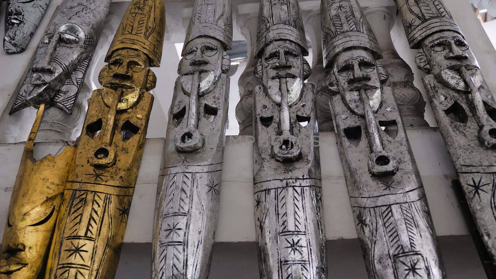 Hindu and Buddhist wooden carving. souvenir shop selling souvenirs and handicrafts of Bali at famous Ubud Market, Indonesia