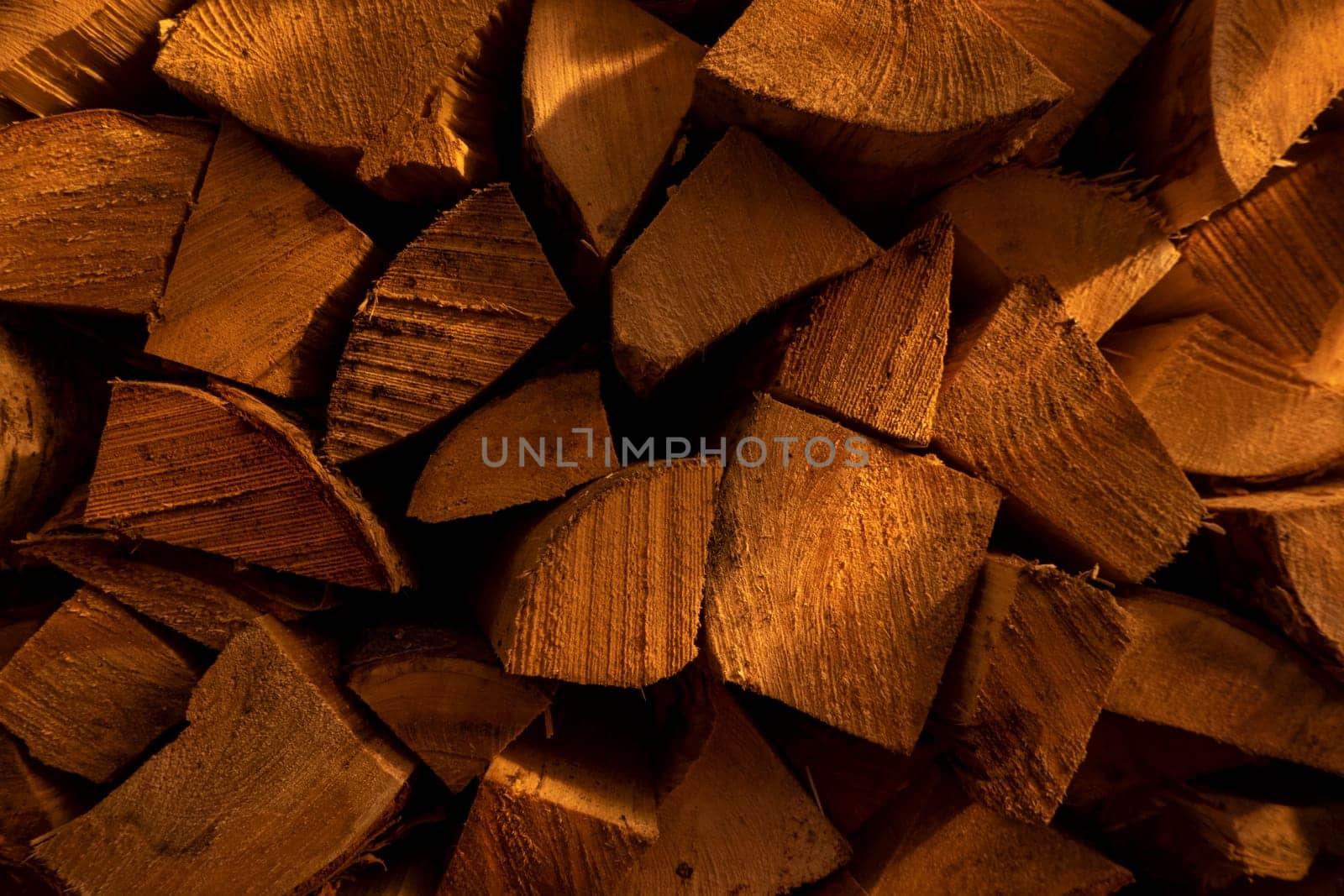 Log spruce trunks pile. Sawn trees from the forest. Logging timber wood industry. Cut trees along a road prepared for removal. High quality photo