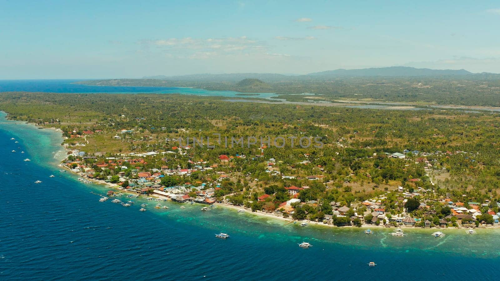 Coastline with coral reef and blue water, diving site, Moalboal, Philippines. Aerial view, Summer and travel vacation concept.