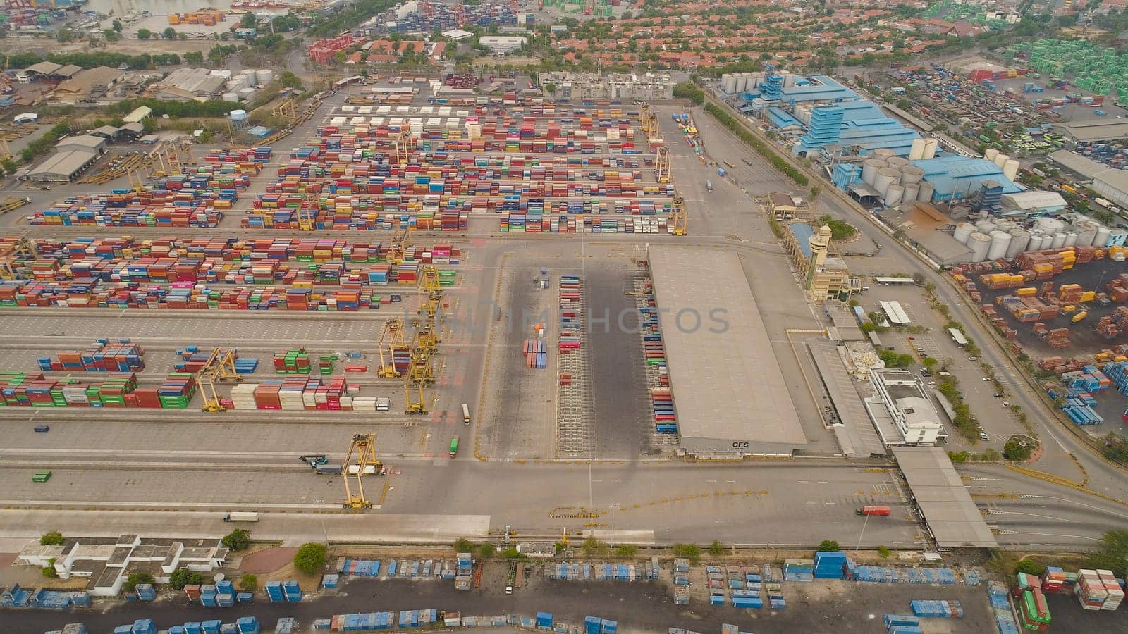 aerial view container terminal port surabaya. cargo industrial port with containers, crane. Tanjung Perak, indonesia. logistic import export and transport industry