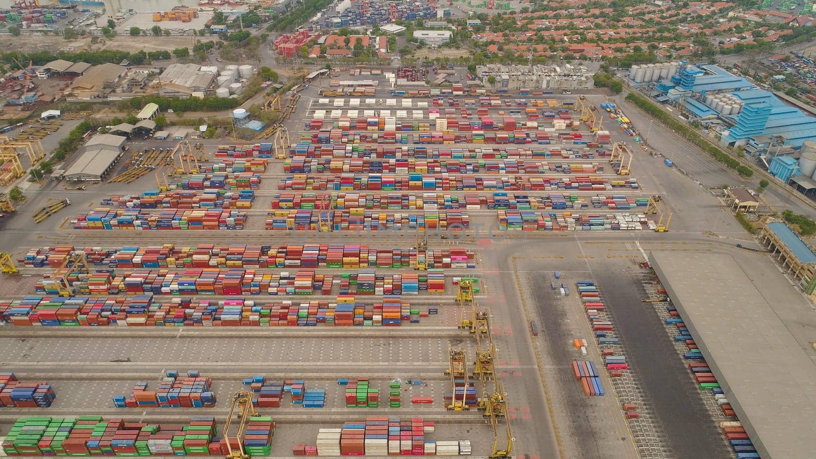 aerial view container terminal port surabaya. cargo industrial port with containers, crane. Tanjung Perak, indonesia. logistic import export and transport industry