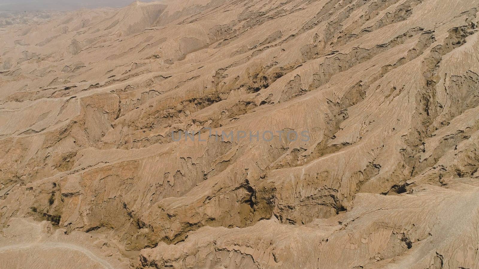 Volcanic landscape around volcano. aerial view mountainous relief after volcanic eruption Bromo Tengger Semeru national park Java, Indonesia.