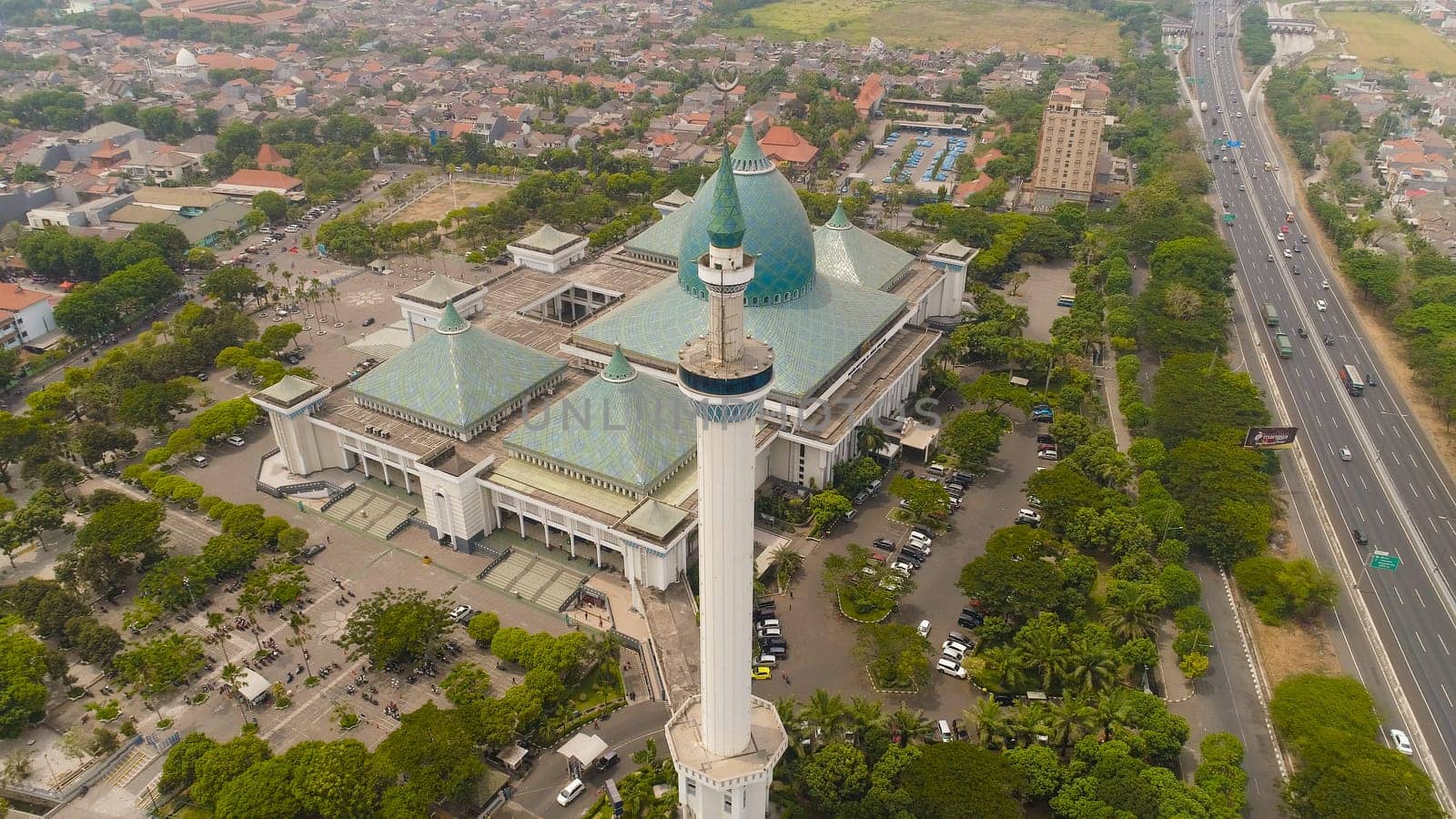 aerial view mosque in Indonesia Al Akbar in Surabaya, Indonesia. beautiful mosque with minarets on island Java Indonesia. mosque in an asian city