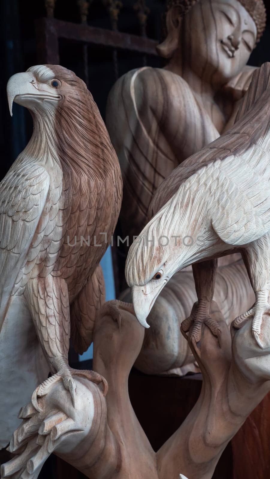 Hindu and Buddhist wooden carving. souvenir shop selling souvenirs and handicrafts of Bali at famous Ubud Market, Indonesia