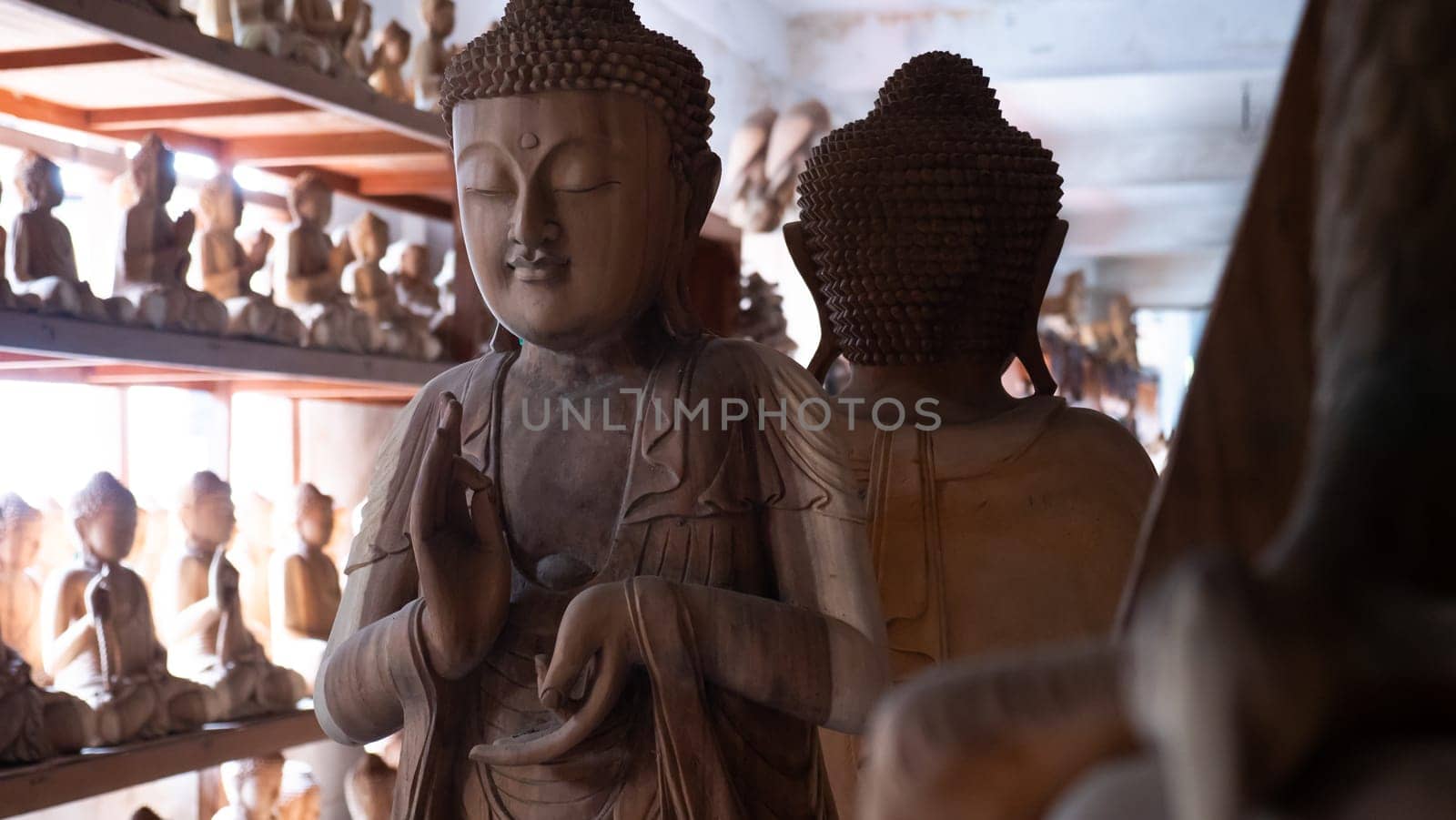 Hindu and Buddhist wooden carving. souvenir shop selling souvenirs and handicrafts of Bali at famous Ubud Market, Indonesia