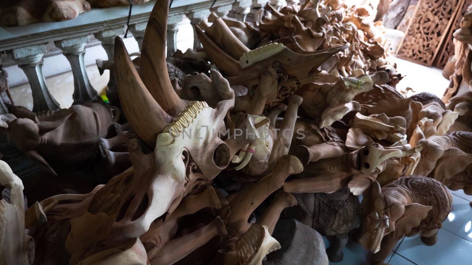 Hindu and Buddhist wooden carving. souvenir shop selling souvenirs and handicrafts of Bali at famous Ubud Market, Indonesia