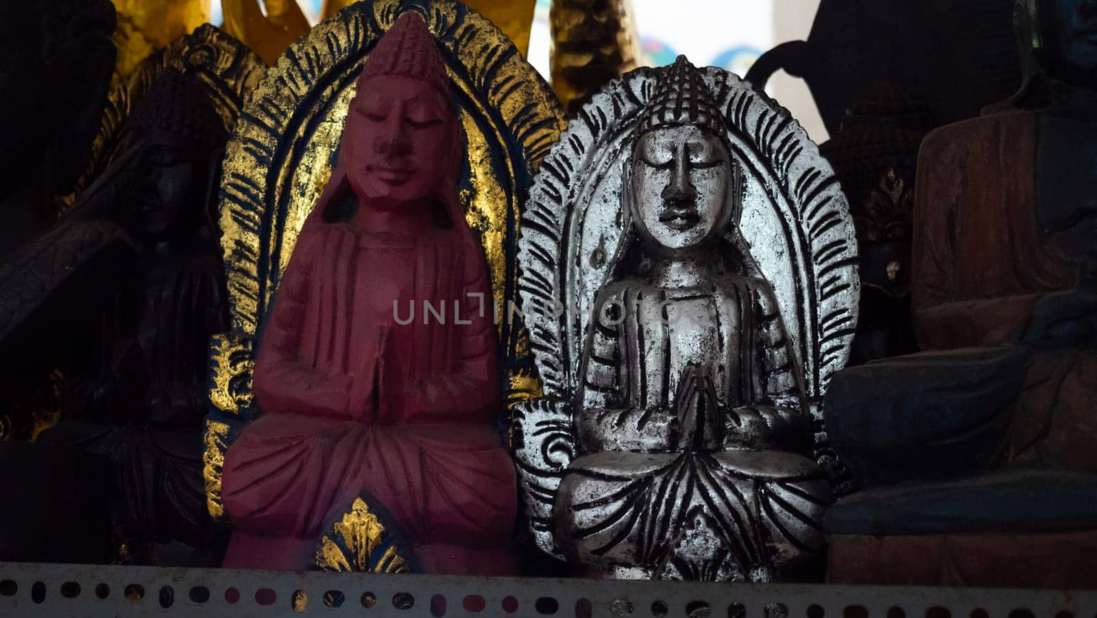 Hindu and Buddhist wooden carving. souvenir shop selling souvenirs and handicrafts of Bali at famous Ubud Market, Indonesia