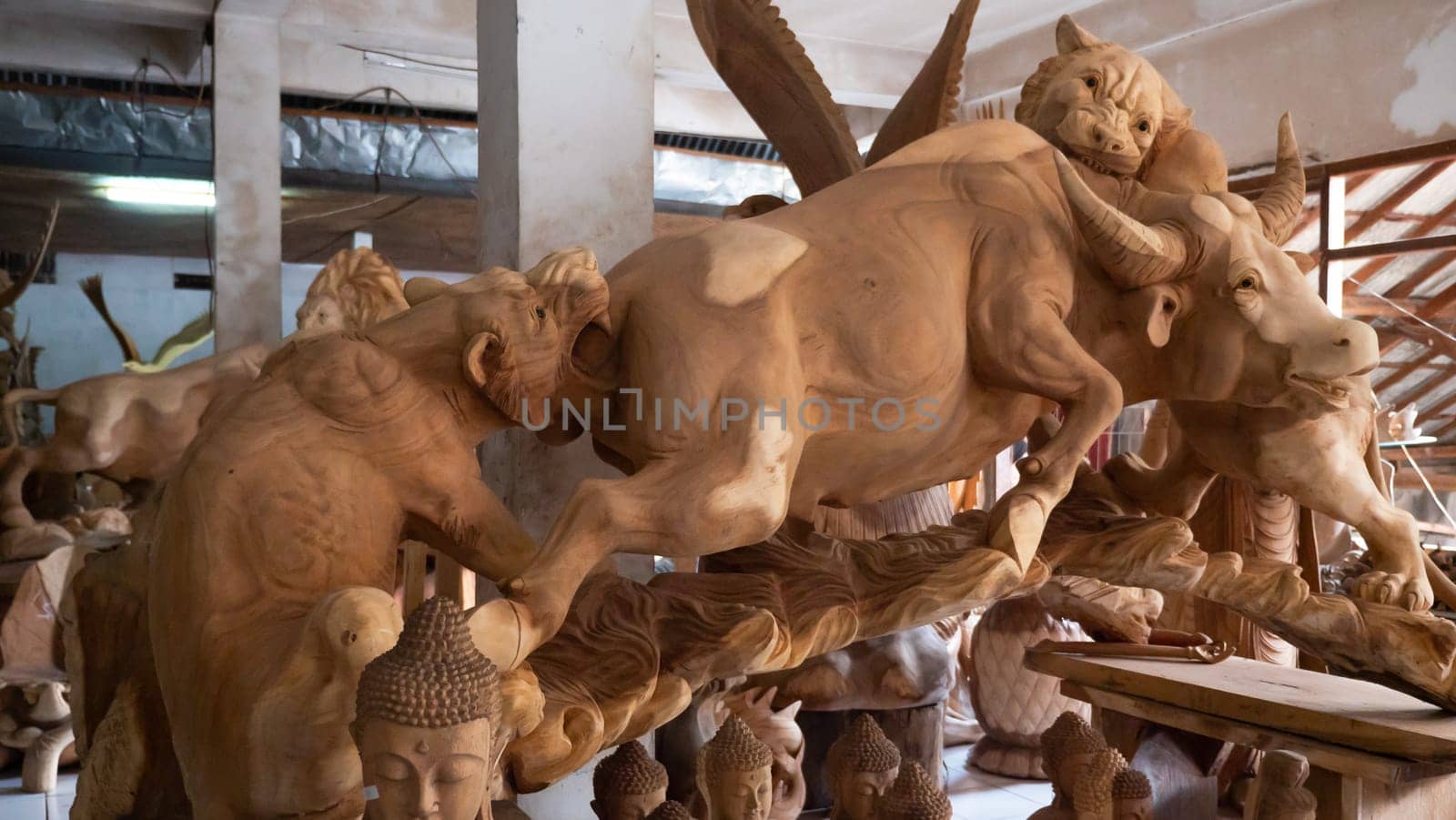 Hindu and Buddhist wooden carving. souvenir shop selling souvenirs and handicrafts of Bali at famous Ubud Market, Indonesia