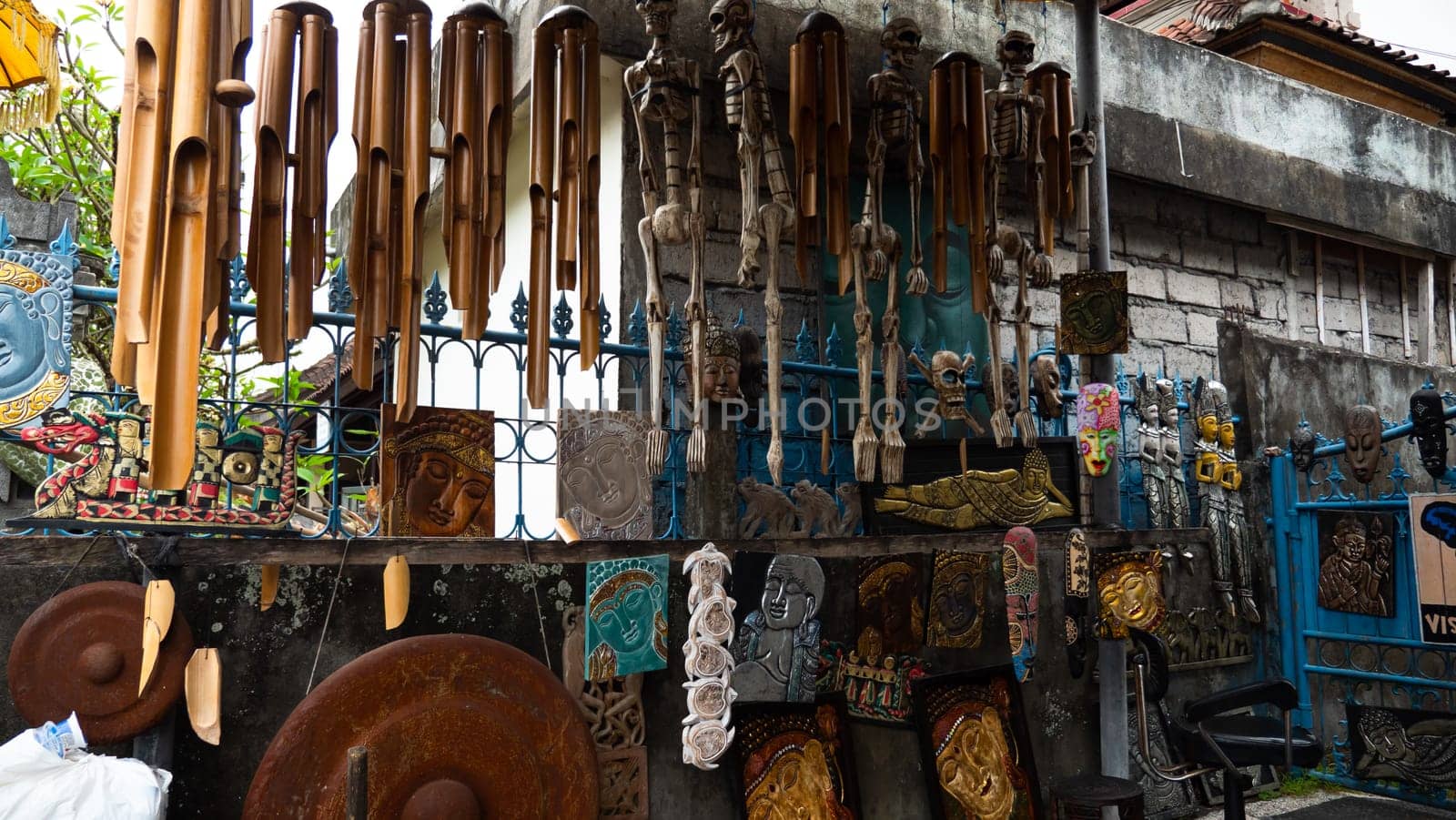 Hindu and Buddhist wooden carving. souvenir shop selling souvenirs and handicrafts of Bali at famous Ubud Market, Indonesia