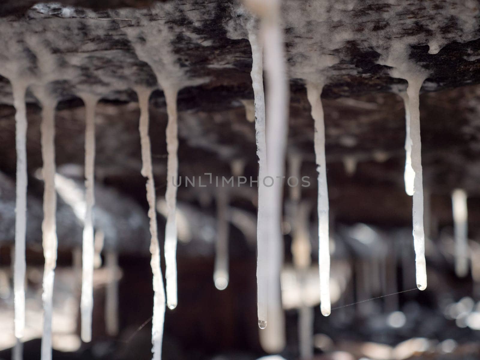 Production of sea salt in the Bali,Indonesia. Salt crystallizes out of the ground in salt farm, filled with natural salt from the sea.