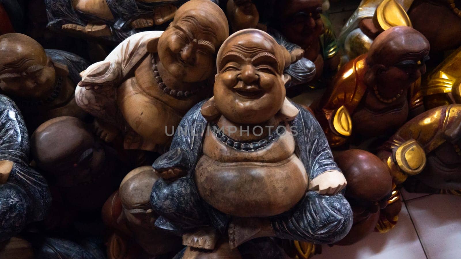 Hindu and Buddhist wooden carving. souvenir shop selling souvenirs and handicrafts of Bali at famous Ubud Market, Indonesia