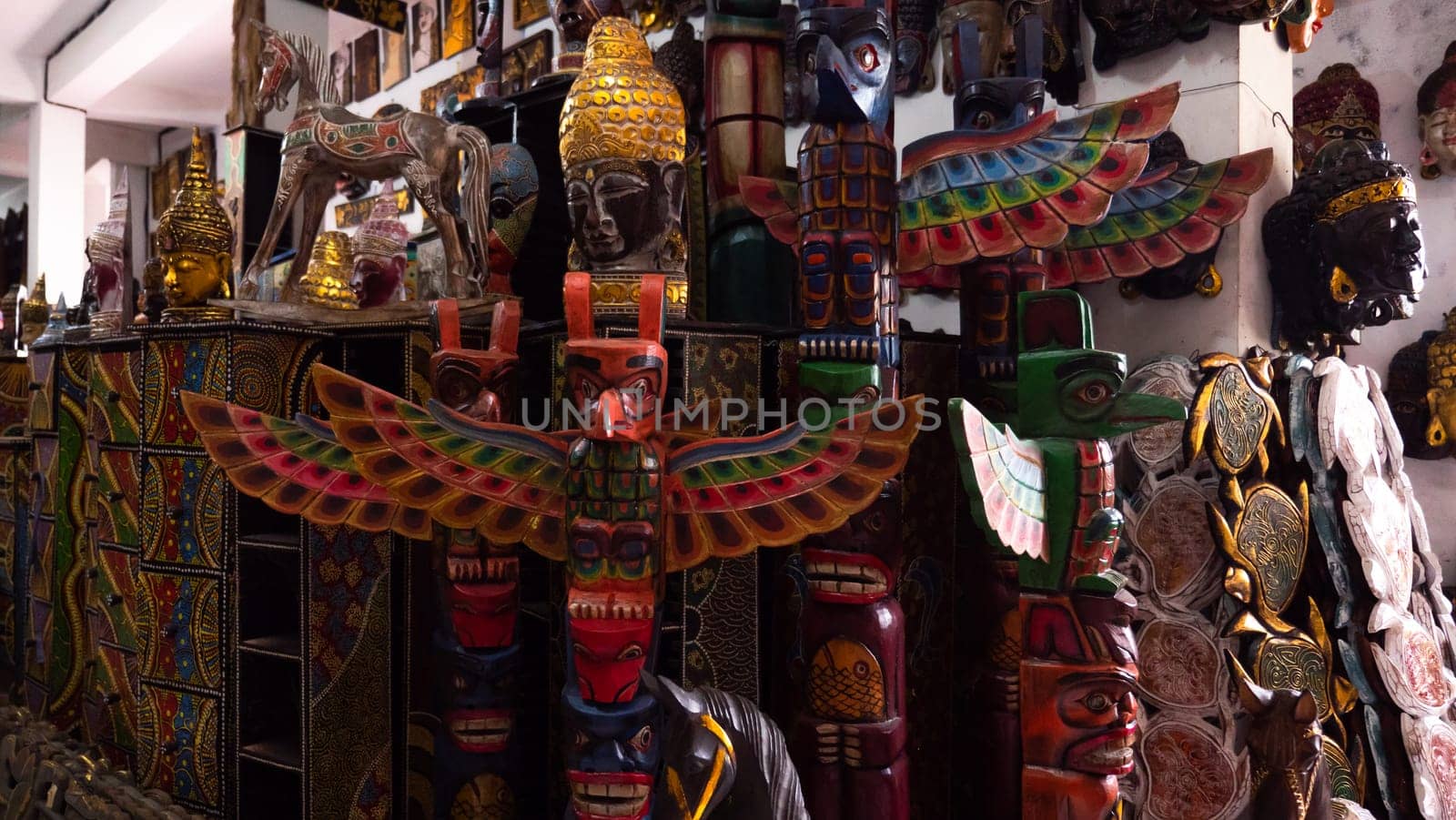 Hindu and Buddhist wooden carving. souvenir shop selling souvenirs and handicrafts of Bali at famous Ubud Market, Indonesia