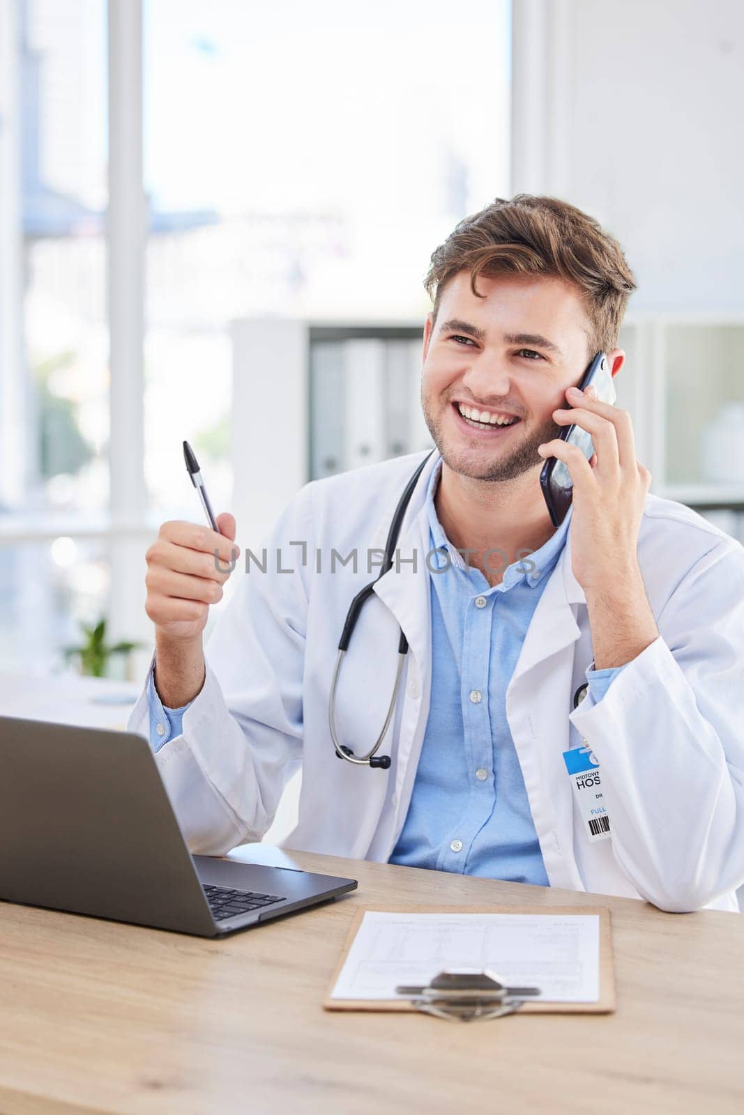 Man, doctor or phone call in hospital office for networking, life insurance help or surgery planning. Smile, happy or talking healthcare worker and communication technology, laptop or clipboard paper by YuriArcurs