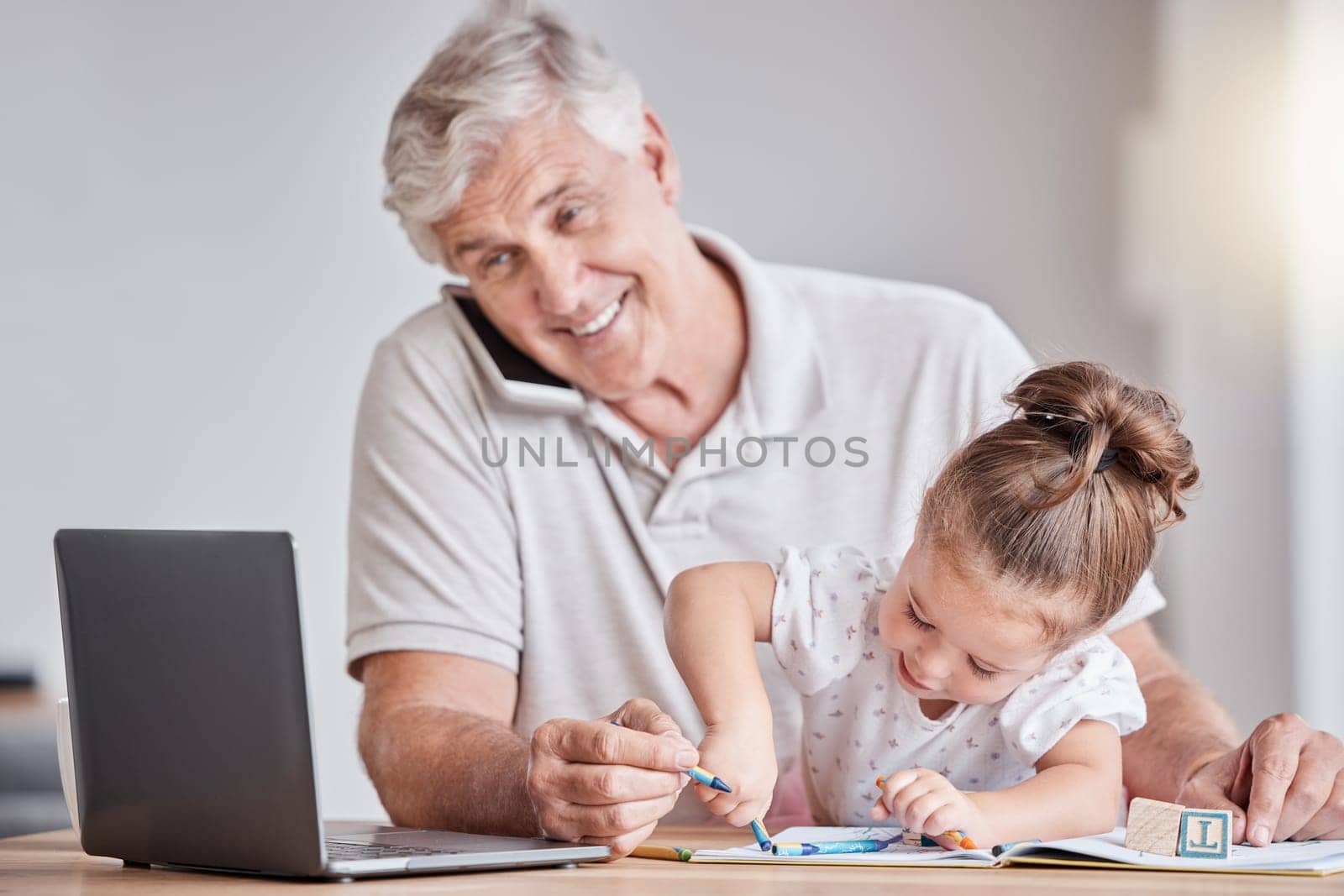 Laptop, phone call or senior man and child in remote working network, communication or marketing consulting. Smile, happy or grandfather bonding with girl, grandkid or working from home on technology by YuriArcurs