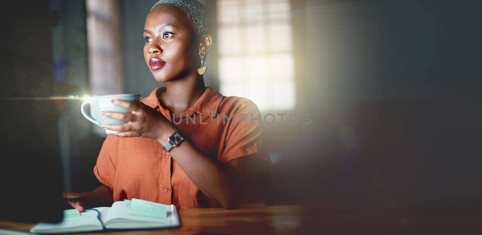 Black woman, coffee and night at office with computer, notebook and mockup space for planning, strategy or analysis. Executive, dark workplace or book for notes, schedule or agenda for small business.