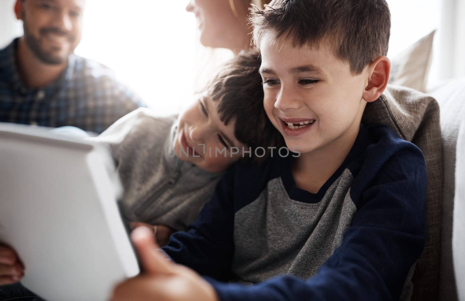 Laughing kids, bonding or tablet for movies streaming, esports or social media on house or family home living room. Smile, happy or fun brother on digital technology, children learning or team gaming.