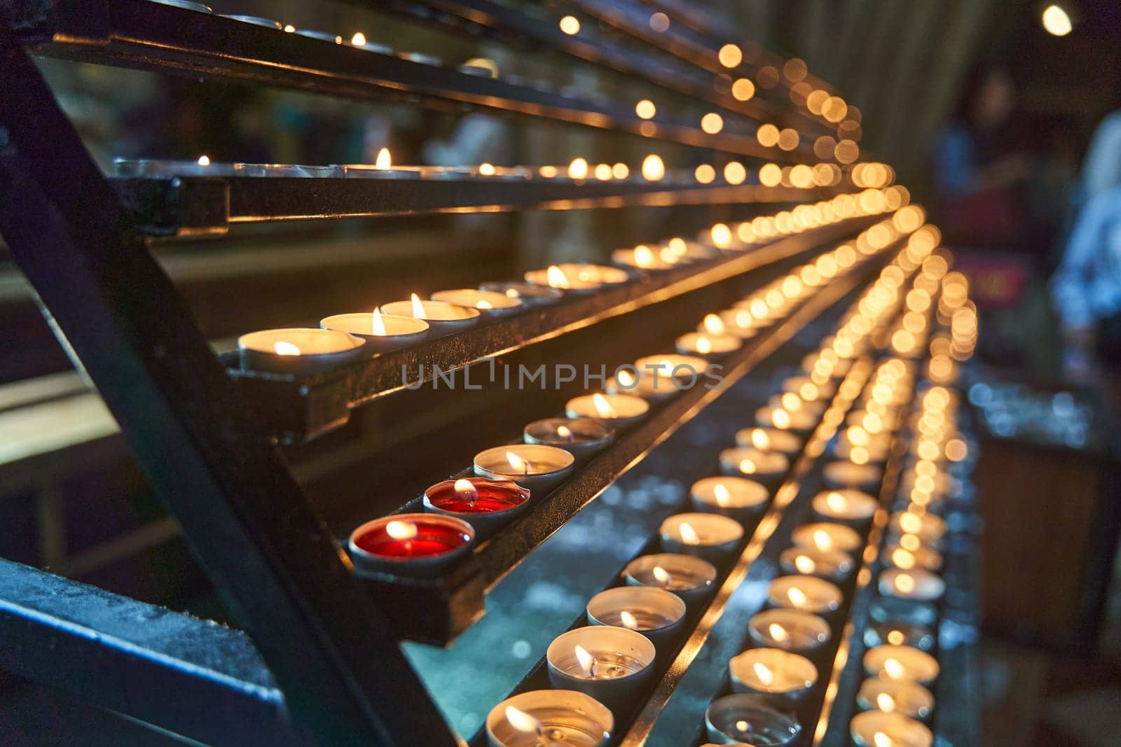 Many candles burn in a temple in Vienna. High quality 4k footage.