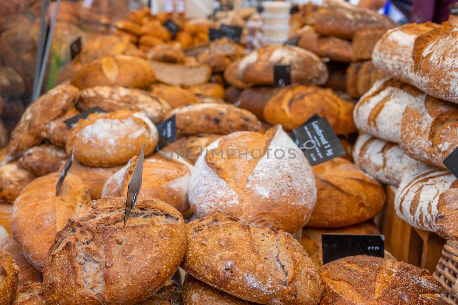 Netherlands. Farmers market in Amsterdam. Many loaves of fresh bread close-up