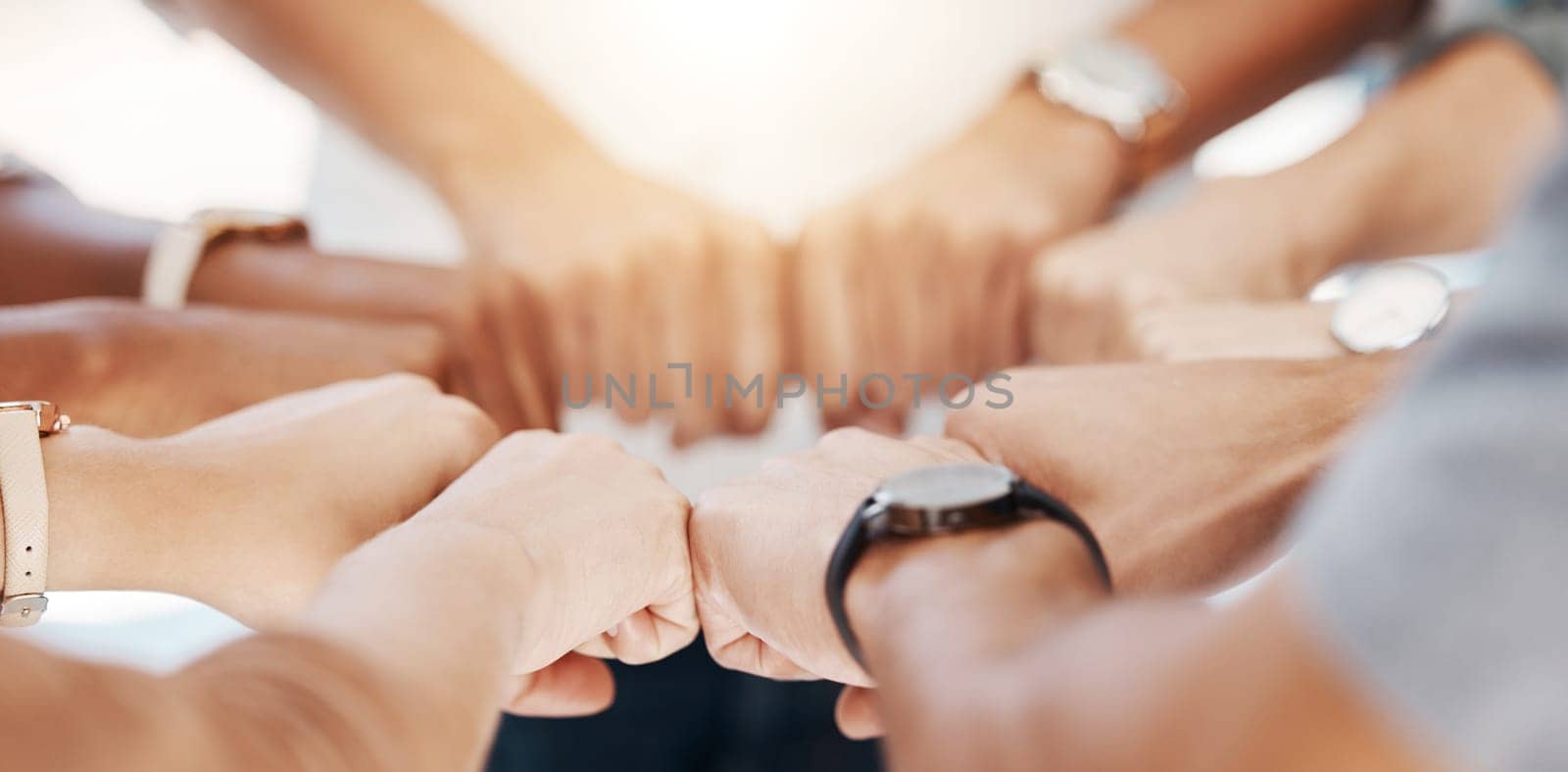 Group, circle and fist bump with team building closeup, community or collaboration for goals in office. Business people, synergy and productivity with solidarity, agreement or networking in workplace.