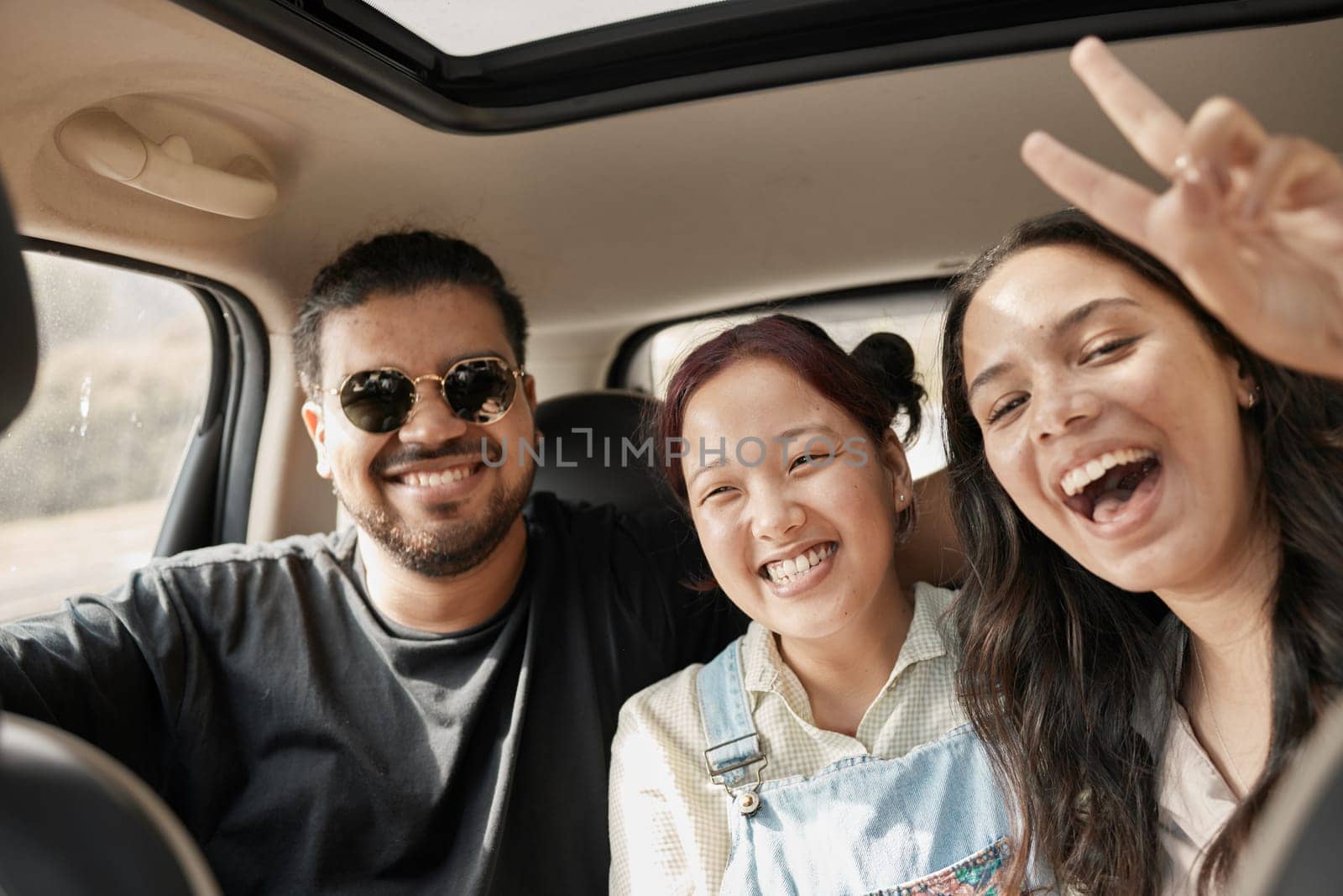 Travel, road trip and car with people or friends portrait excited for journey, holiday or vacation together. Gen z group of people with peace sign driving for safety, transportation and adventure by YuriArcurs